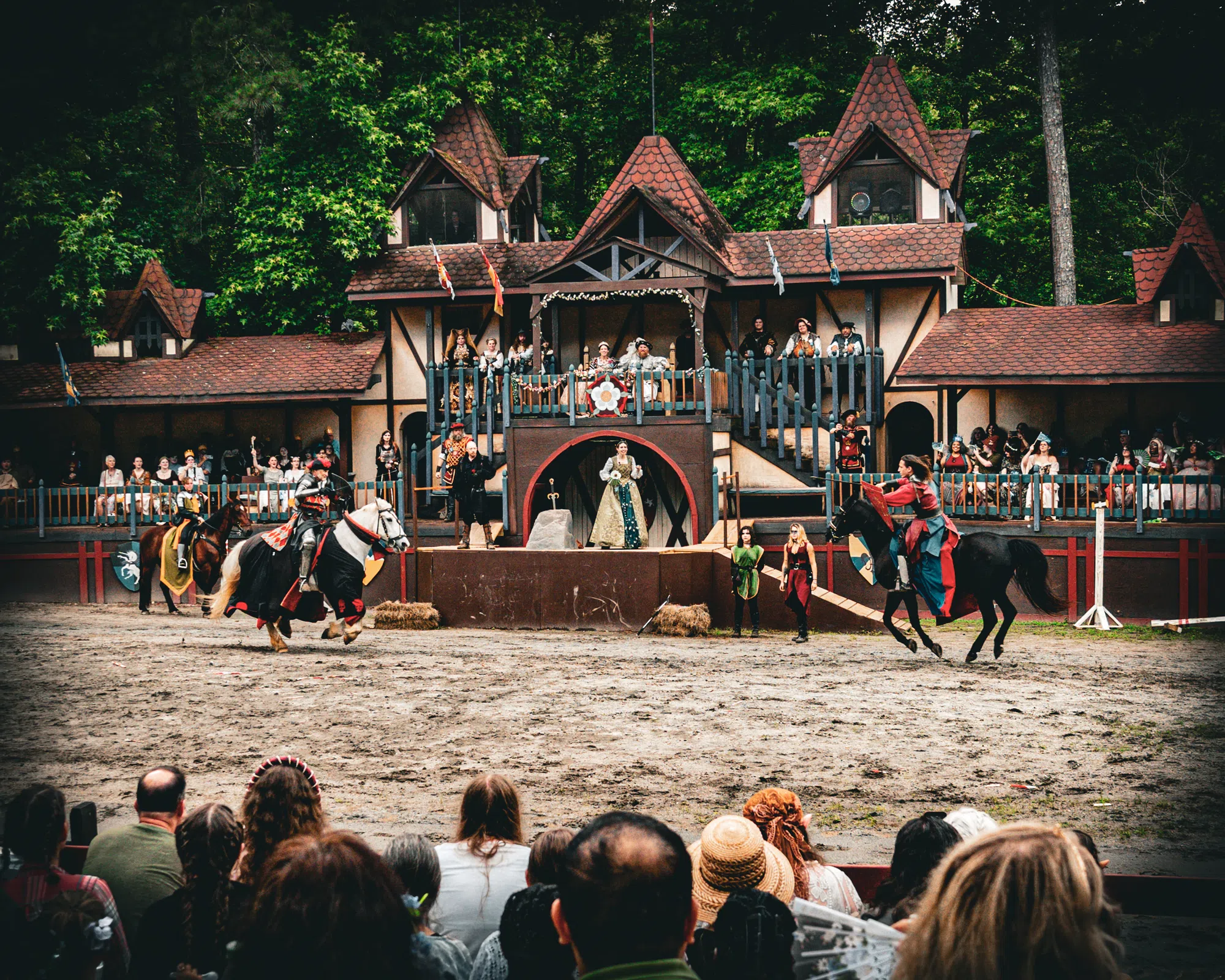 Knights charging on horseback at the joust field of the Georgia Renaissance Festival