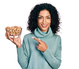 Ritu Kumar holding a bowl of nuts