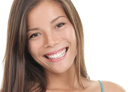 Young woman with long brown hair smiling