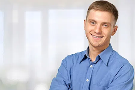 Smiling young man in blue shirt