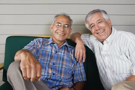 Two senior men smiling
