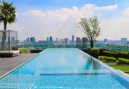 a pool with a city in the background