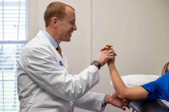 a man in a white coat