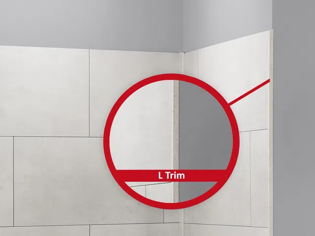 Close-up of L trim edge finishing on tiled wall corner in neutral-toned interior space.