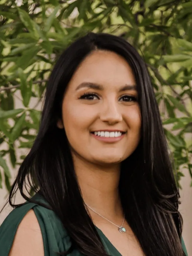 a woman smiling for the camera