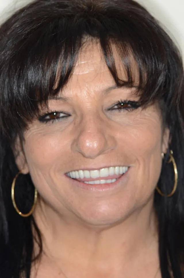 a close-up of a woman smiling