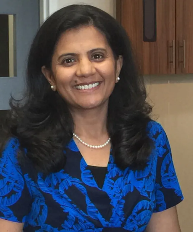 a woman smiling for the camera