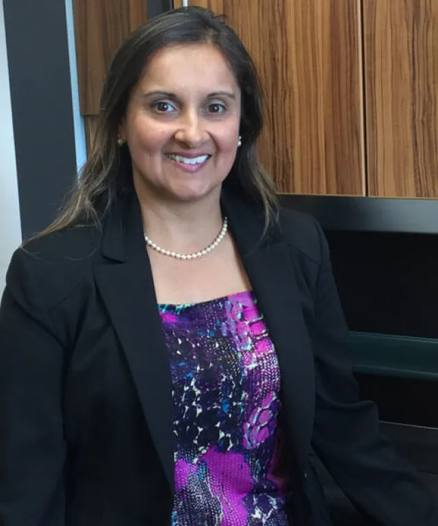 a woman smiling for the camera