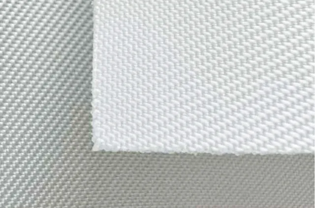 Close-up of white textured canvas fabric highlighting its woven pattern and fine details.