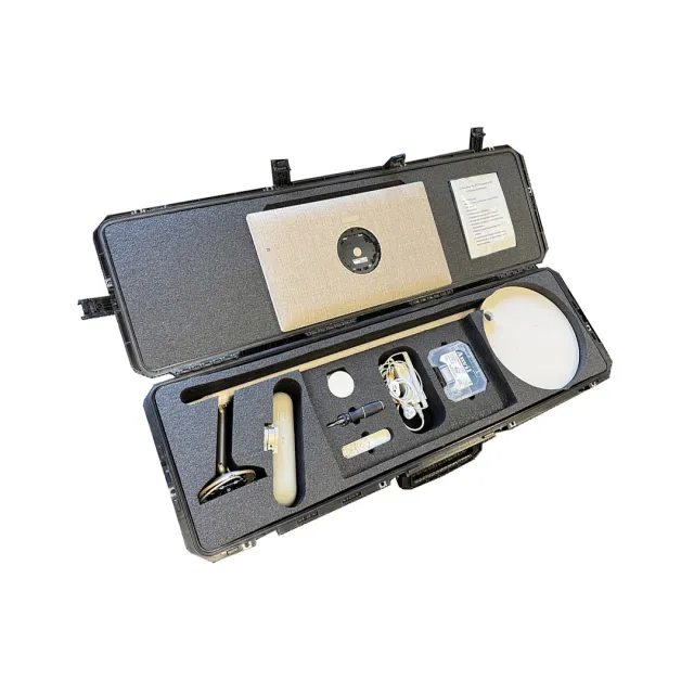 Black hard case with custom foam holds electronic devices and accessories organized inside.