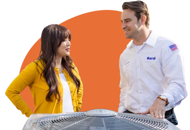 a man and a woman looking at a computer screen