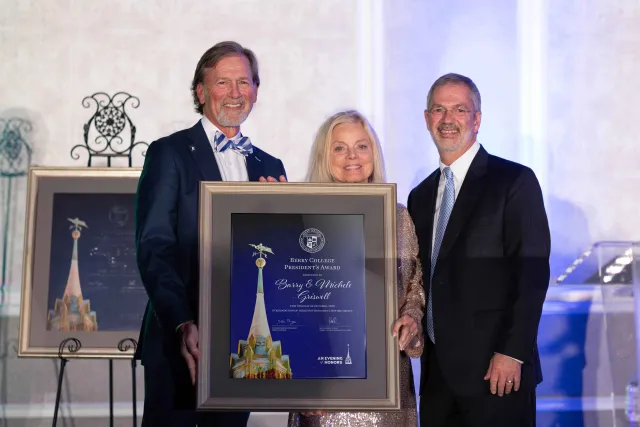 a group of people holding a plaque