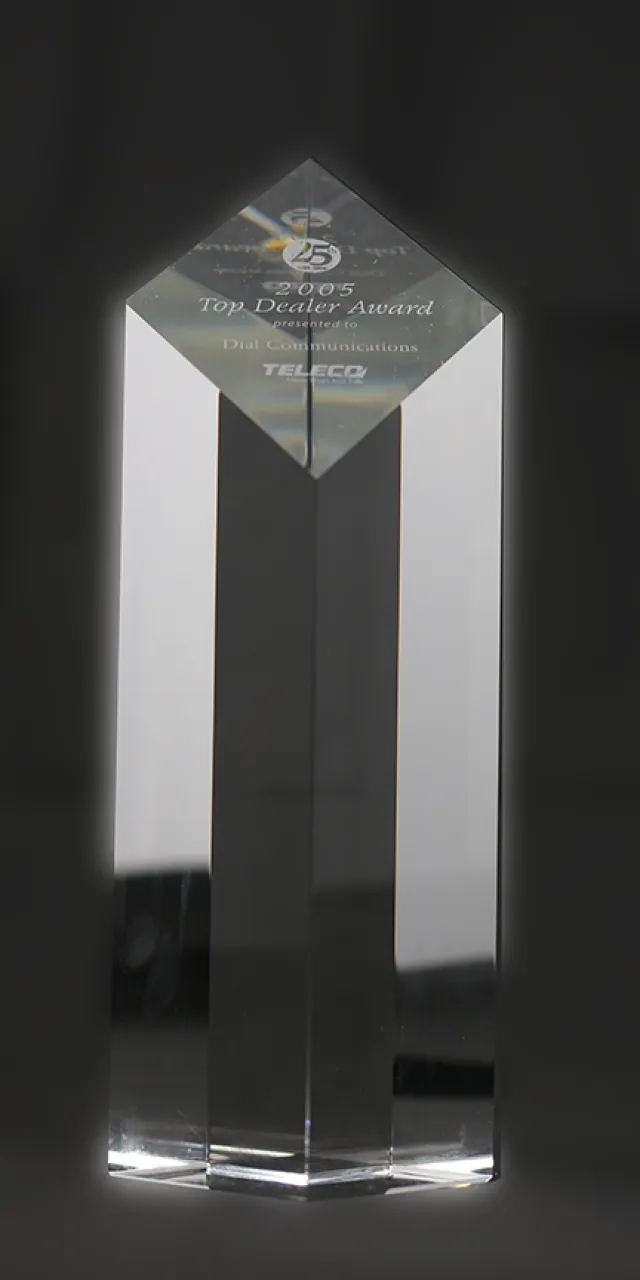 Crystal award engraved with text, showcasing a top dealer achievement for Dial Communications.