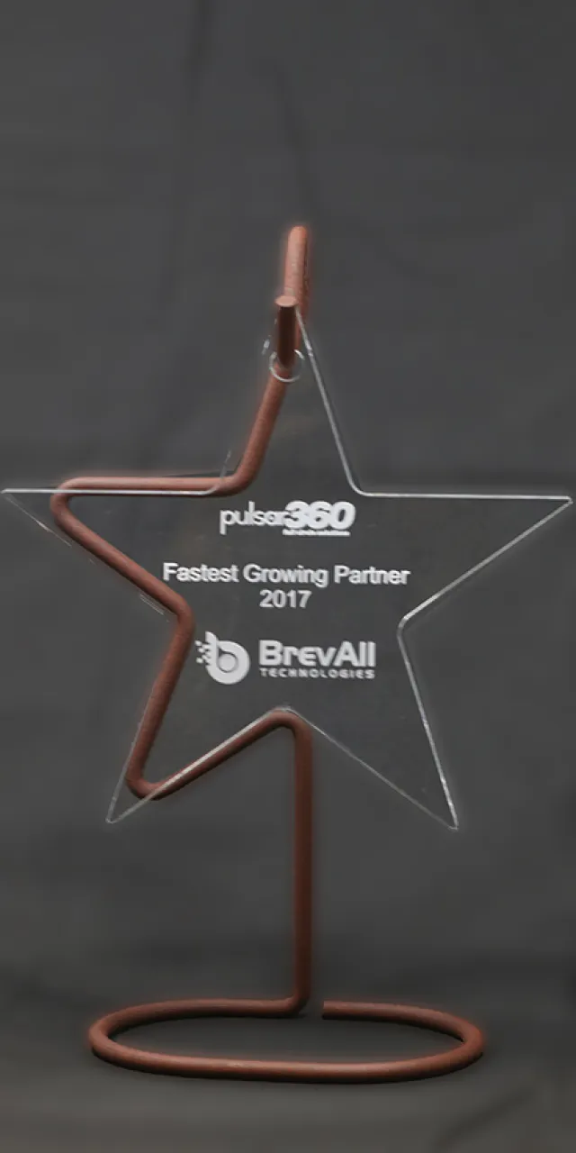 Star-shaped award on a copper stand reading Pulsar360 Fastest Growing Partner 2017 BrevAll Technologies