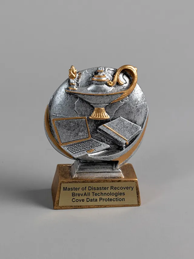 Award trophy featuring a lamp and laptop, celebrating disaster recovery excellence by BrevAll Technologies.
