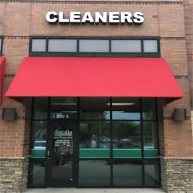 a building with a red awning