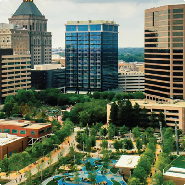 a group of buildings with a pool