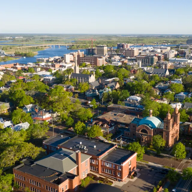 a city with many trees and buildings