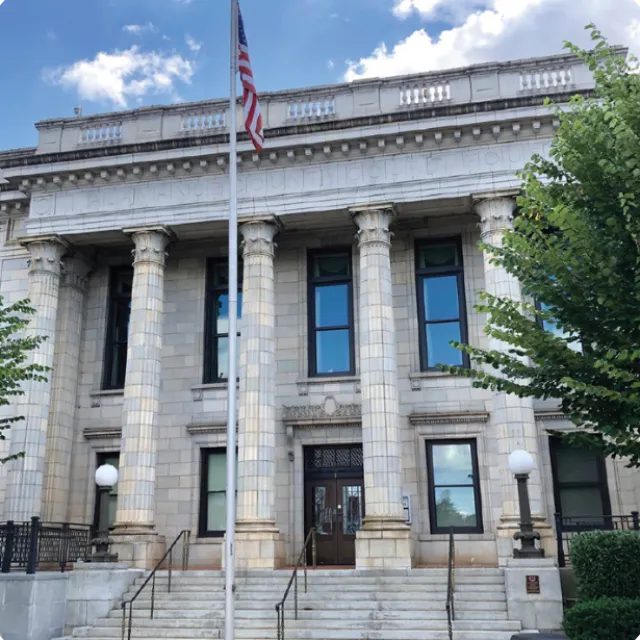 a building with a flag on the front
