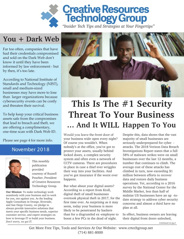 Businessman shocked by cybersecurity breach while working on laptop in office with bookshelves behind him