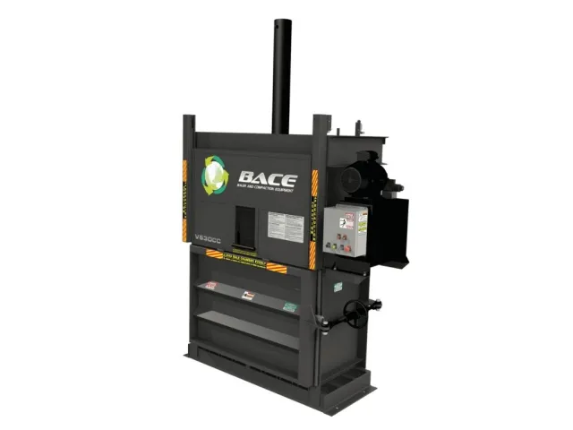 Industrial vertical baler machine with control panel and hydraulic press for compacting materials.