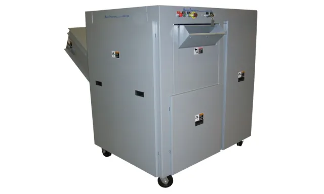 Industrial gray metal shredder machine with control panel and wheels for mobility on white background
