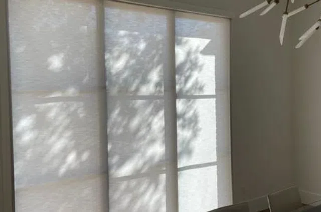 Light filtering roller shades letting in natural light