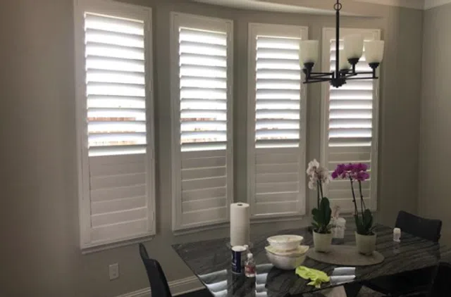 Plantation shutters installed on a window