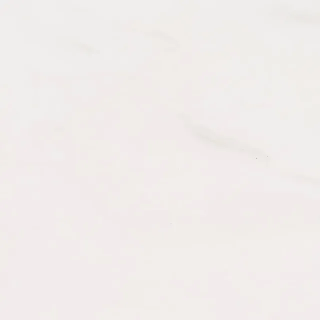 a white surface with a few cracks