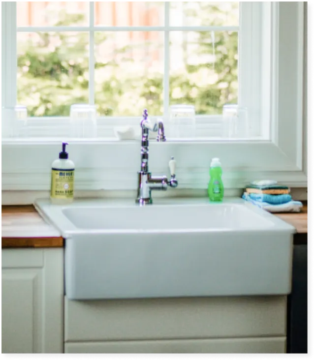 a sink with a faucet and a window