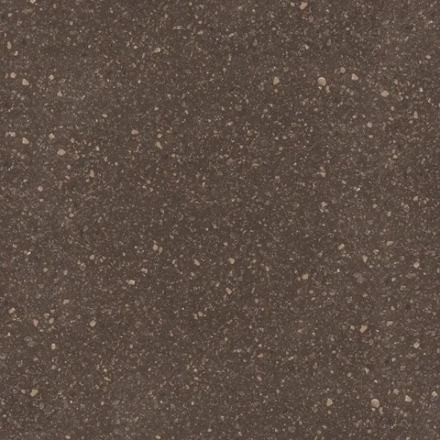 a black surface with small white specks on it