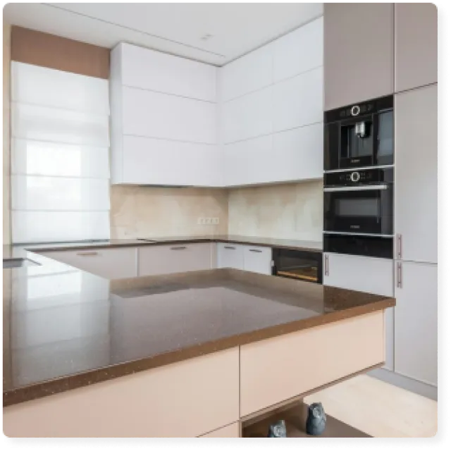 a kitchen with white cabinets