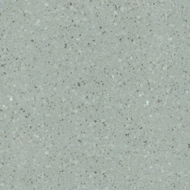 a white surface with small specks