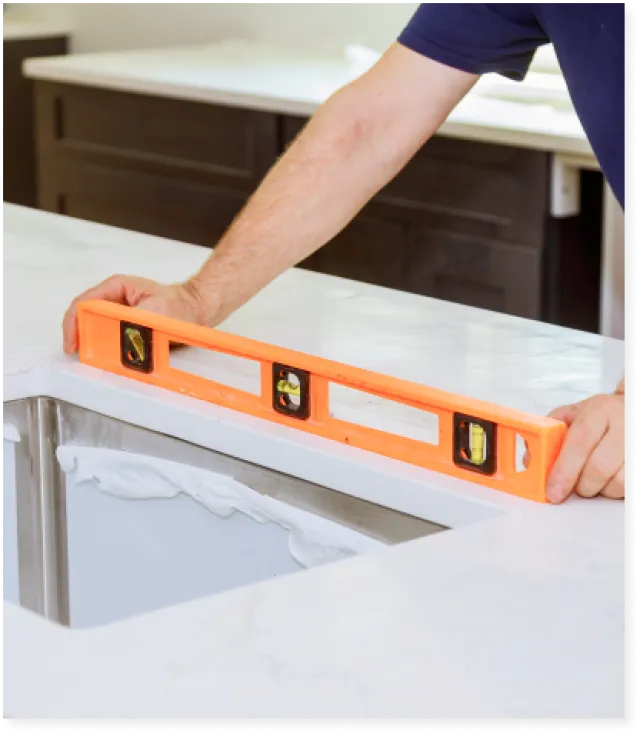 a person using a level on a countertop