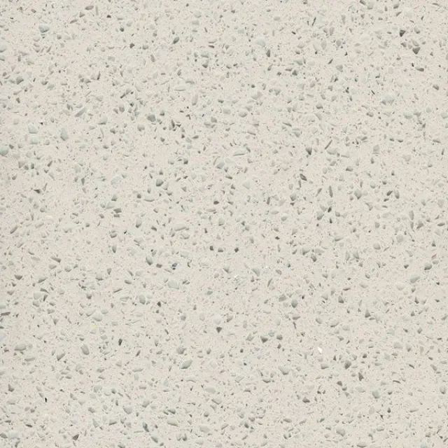 a white surface with small specks