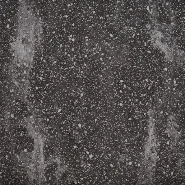 a black and white photo of a grey surface