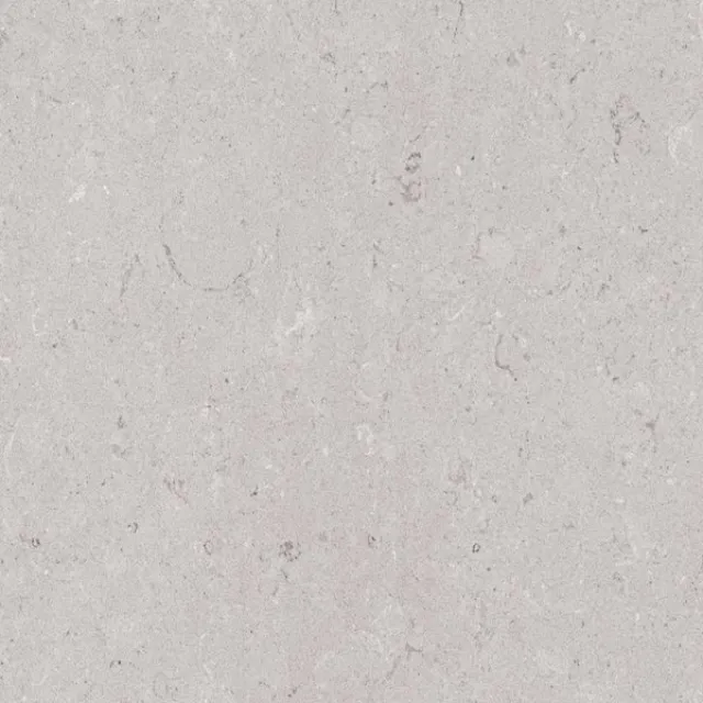 a white surface with black specks
