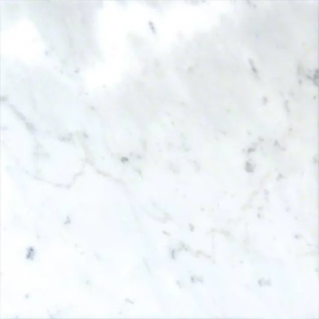 a white surface with small specks