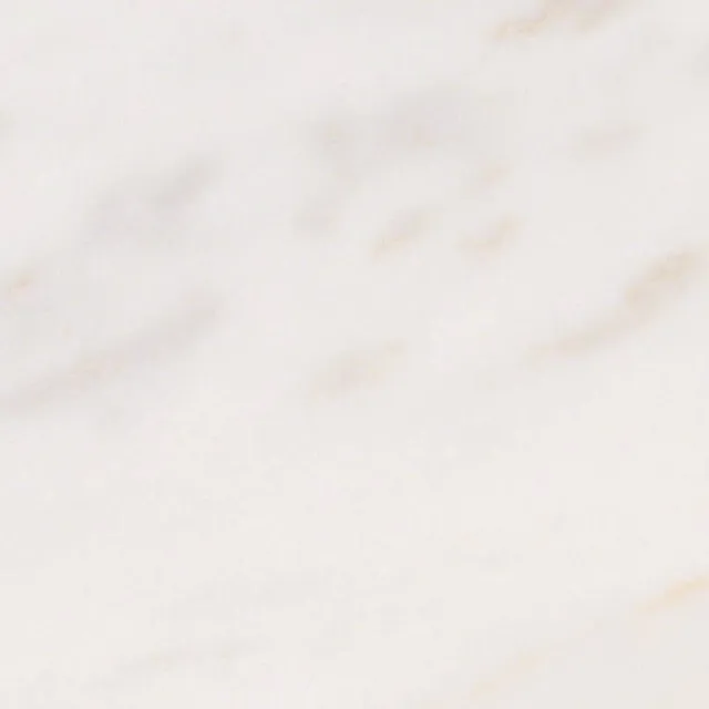 a white surface with a few cracks