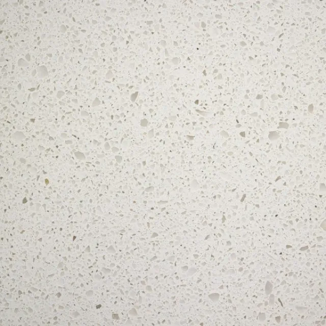 a white surface with small specks