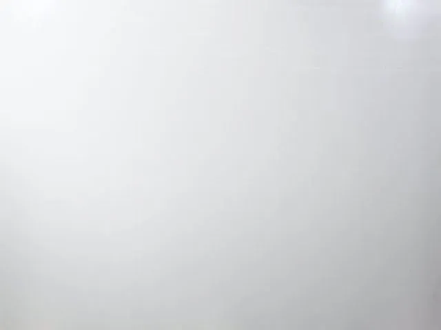 a white surface with a black background