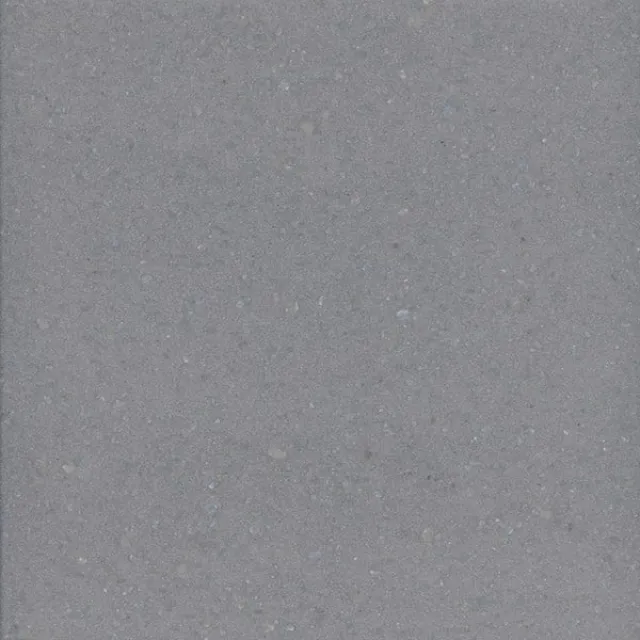 a white surface with small specks