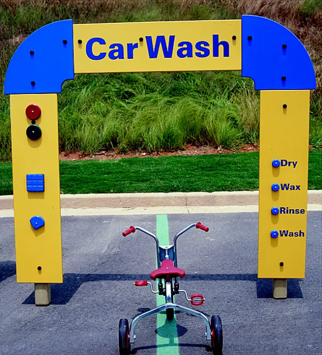 a bicycle parked next to a sign