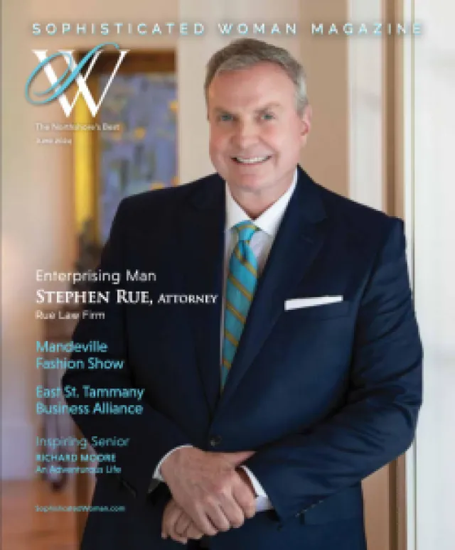 Stephen Rue, attorney, in navy suit and striped tie, featured on cover of Sophisticated Woman Magazine.