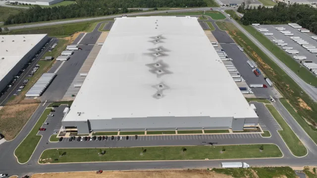 a large building with a parking lot