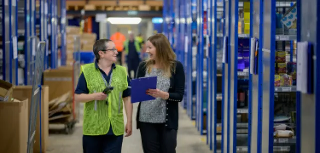 a few people in a warehouse
