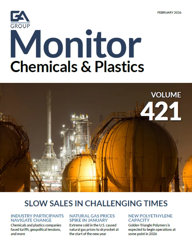 Industrial chemical plant with spherical storage tanks illuminated at night under dark sky