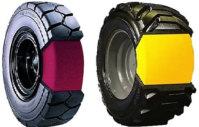 Two heavy-duty tires with cutaway sections showing colored internal structure, one red and one yellow.