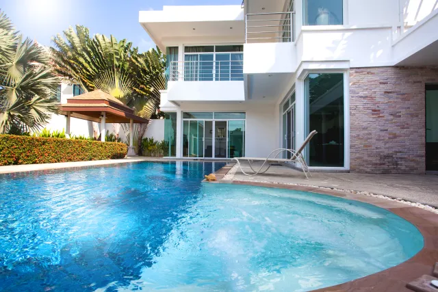 a swimming pool in front of a building