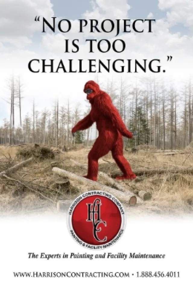Red Bigfoot walking over logs in forest clearing with text No project is too challenging and contractor logo.